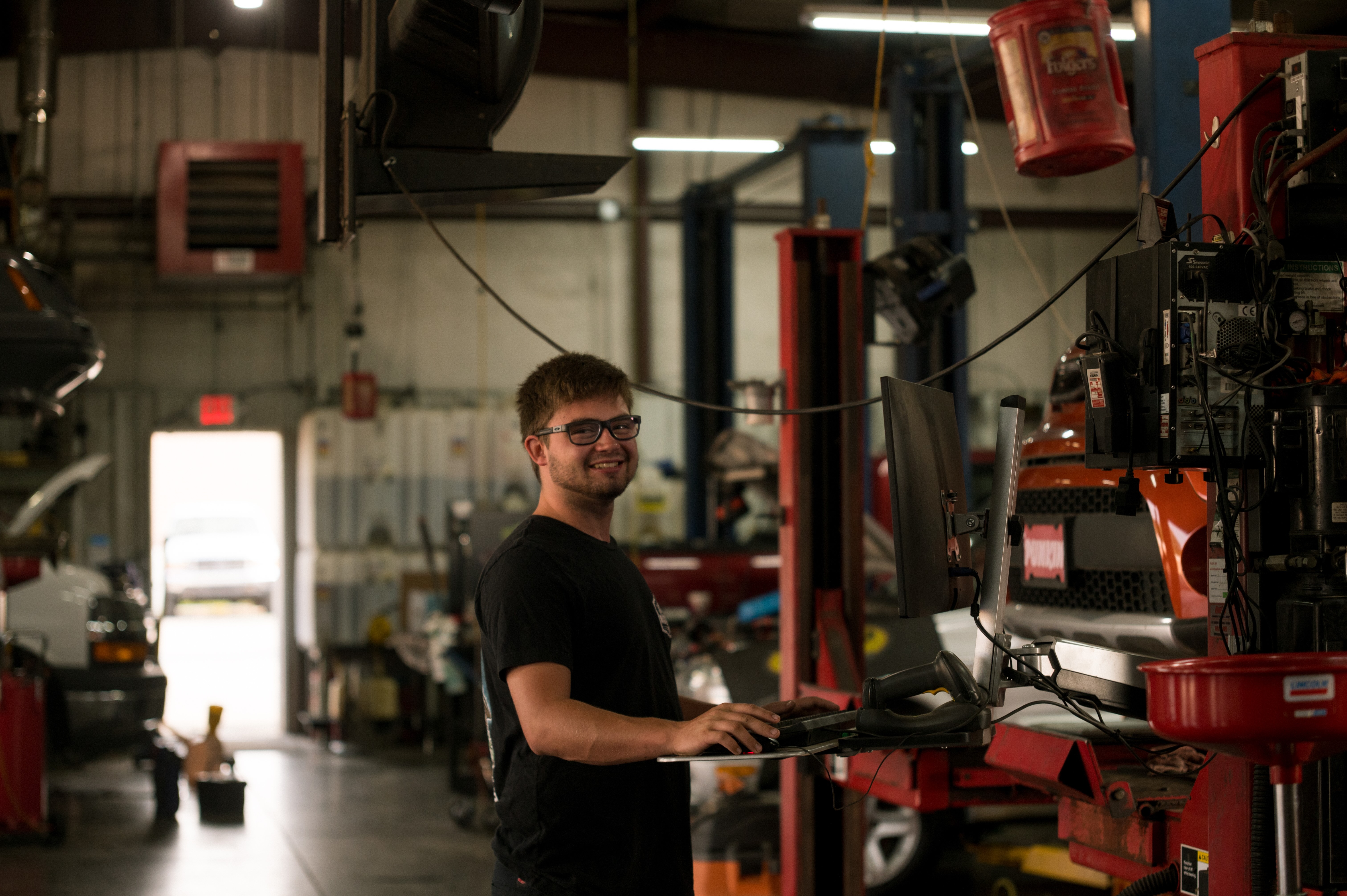Technician working at a computer bay