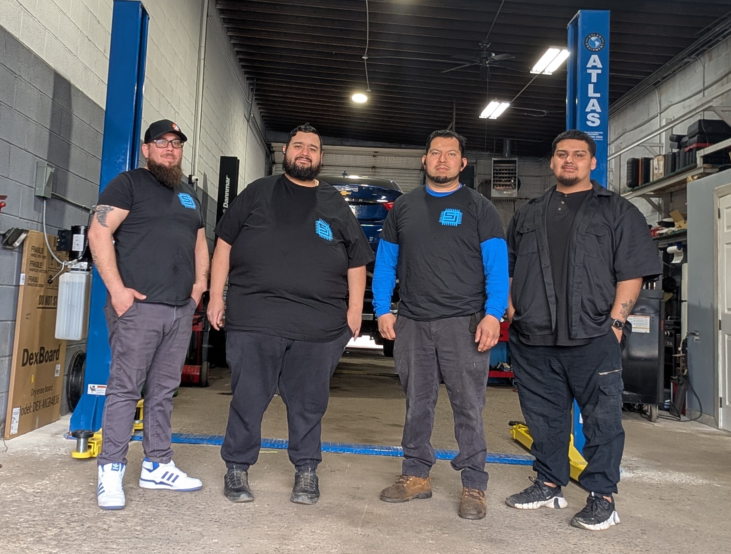 Auto workers in a repair shop